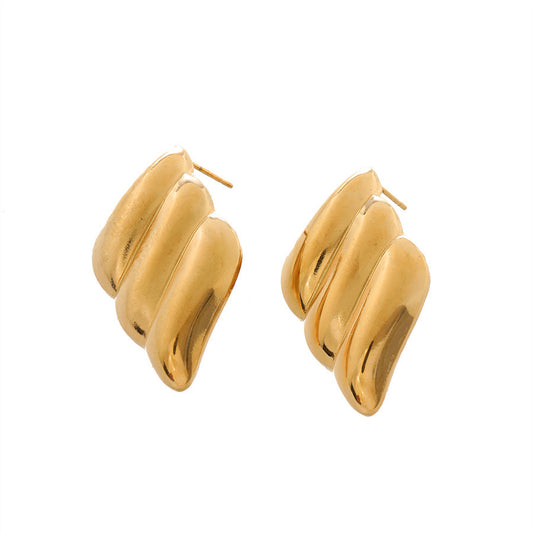 Aretes en forma de conchas y espiral acero de titanio