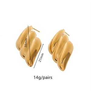Aretes en forma de conchas y espiral acero de titanio Aretes en forma de conchas y espiral acero de titanio