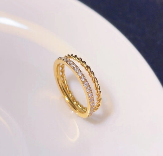 Anillo doble con circonias trenzado dorado