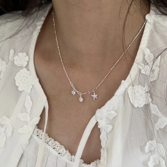 Collar con dijes de concha estrella de mar
