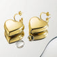 Aretes de corazón dorados