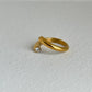 Anillo abierto cruzado