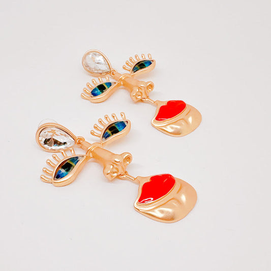 Aretes Rostro misterioso dorados