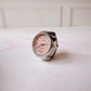 Anillo Reloj eterno glam plateado con rosa
