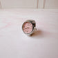 Anillo Reloj eterno glam plateado con rosa