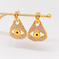 Aretes Anatomy Ojo amarillo con brillos