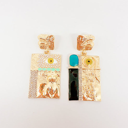 Aretes Anatomy Torso y ojos dorados