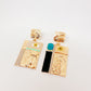 Aretes Anatomy Torso y ojos dorados