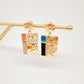 Aretes Anatomy Torso y ojos dorados