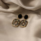 Aretes casuales en tendencia negros
