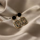 Aretes casuales en tendencia negros