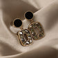 Aretes casuales en tendencia negros