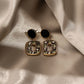 Aretes casuales en tendencia negros