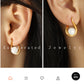Aretes elegantes con perla en forma de gota
