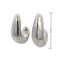 Aretes estilo chunky dorados plateados curvos formal casual