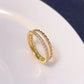 Anillo doble con circonias trenzado dorado