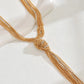 Corbatero collar elegante dorado