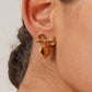 Aretes románticos de corazón con moño