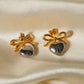 Aretes románticos de corazón con moño