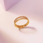Anillo doble con circonias trenzado dorado