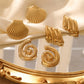Aretes en forma de conchas y espiral acero de titanio
