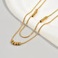 Collar básico mini esferas doble dorado casual